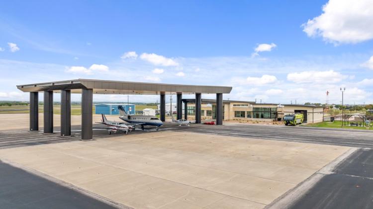 Emergency vehicles gathered at an airport runway during a simulated aircraft crash exercise in Temple, Texas.