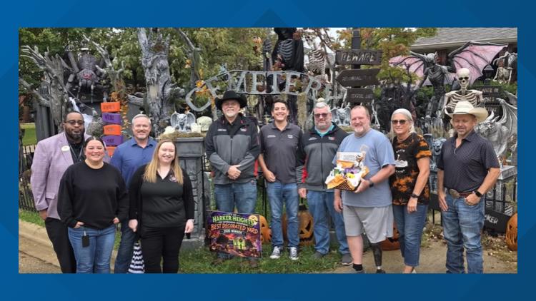 A beautifully decorated Halloween yard in Harker Heights with tombstones and spooky decorations.